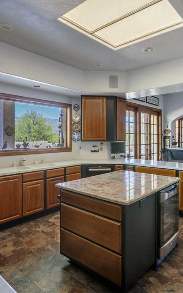 Counter tops and cabinets around a sink after a remodeling.